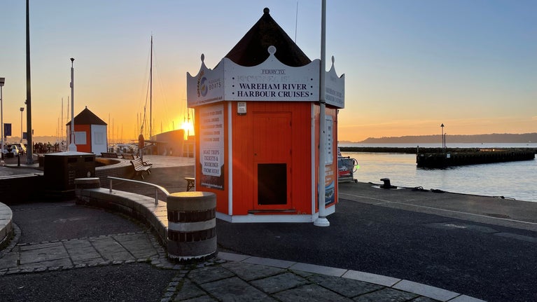 Greenslade ferry orange kiosk on Poole Quay